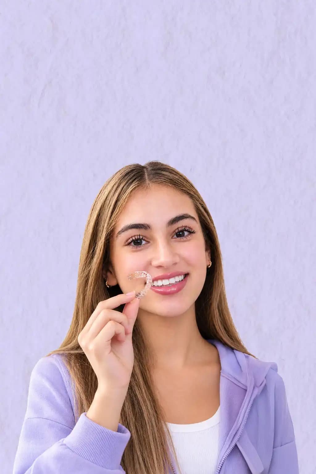 Teen wearing BASMA clear aligners